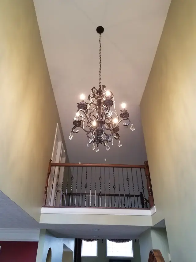 Bronze chandelier hung by Burtner Electric in a two story Hamilton County foyer